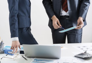 Business partnership concept with business people. Office desk with financial analytics. Business