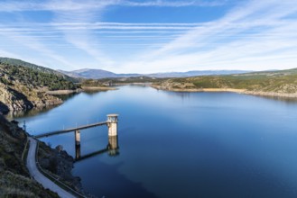 The Atazar reservoir and control tower of Dam in the mountain range of Madrid