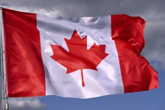 Close-up of the national flag of Canada fluttering in the wind, wave pattern