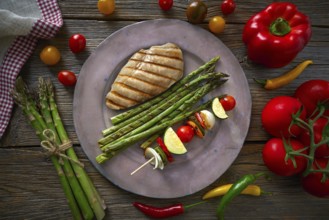 Grilled chicken breast with brochette vegetable with grill asparagus