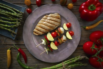 Grilled chicken breast with brochette vegetable with grill asparagus
