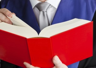 A judge with a law book in court. Jurisdiction and judgments in crime, A judge with a law book in