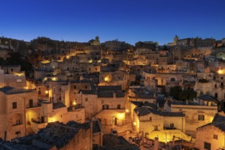 Matera, Italy, 26 November, 2023: view of the old town of Matera after sunset with the lights