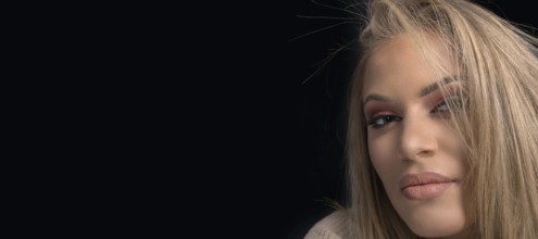 Sensual beautiful blonde woman, beautiful blue-eyed woman. Professional Make-up