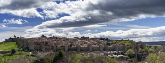 Avila, Spain, 8 April, 2024: panorama view of the medieval walled city of Avila on a beautiful