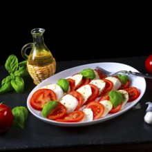 Tomatoes with mozzarella and basil