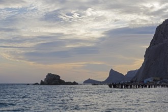 Sunset in the bay of the resort town of Sudak. Crimea