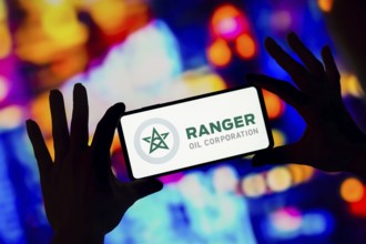 In this photo illustration, the Ranger Oil Corporation logo is displayed on a smartphone screen