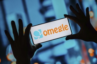 In this photo illustration, the Omegle logo is displayed on a smartphone screen