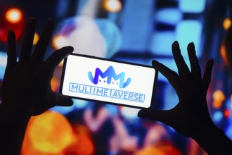 In this photo illustration, the MultiMetaVerse Holdings Limited logo is displayed on a smartphone