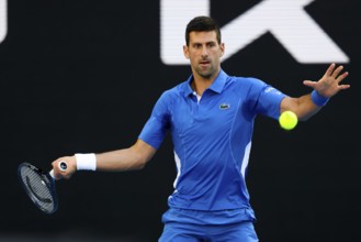 MELBOURNE, AUSTRALIA, JANUARY 11: Novak Djokovic of Serbia plays Stefanos Tsitsipas of Greece
