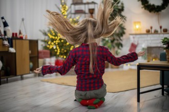 A joyful moment that beautifully captures the festive spirit with a playful young girl celebrating