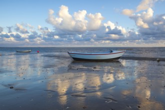 Fishing boats on the empty beach, Hjerting, Jutland, Denmark. Hjerting is a district of Esbjerg in