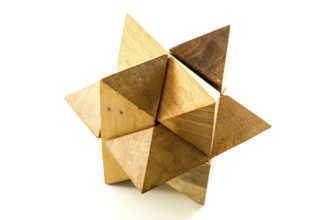 Wooden puzzle isolated on a white background