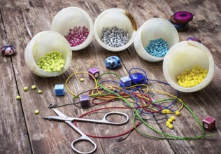 Thread, beads and tools for needlework vintage background