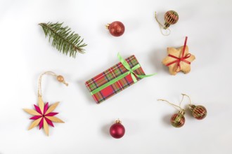 Christmas and New Year composition. Christmas gift, fir tree branches, cookies with festive