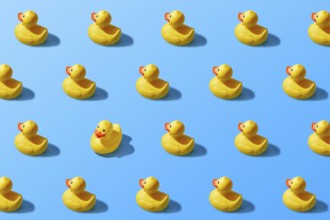 Trendy pop art design of a yellow rubber duck pattern from a top view. Dissenting opinion, chosen
