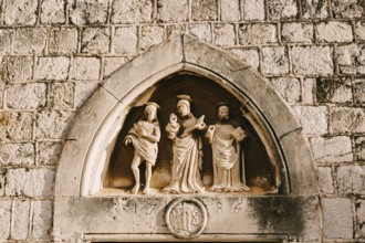 Dubrovnik, Croatia - 04 may 2016: Close-up stone statues, bas-reliefs and high reliefs on the walls