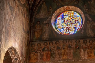 SAN GIMGNANO, ITALY, SEPTEMBER 20, 2023, Colorful old frescoes at the main aisle of the cathedral