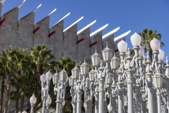A picture of Urban Light, a public art designed by Chris Burden and unveiled in 2008, next to the