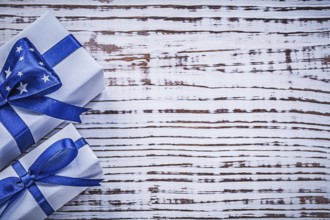 Gift containers on vintage wooden board holidays concept