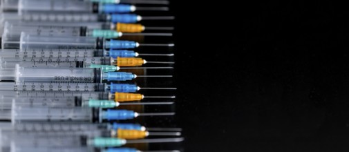 Medical Syringes with Needle on Black Background, Close up Syringe, Health care concept