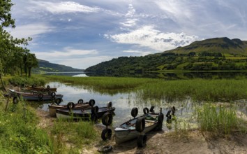 Glencar, Ireland, 16 July, 2022: Glencar Lough landscape with many colorful small wooden fishing