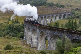 The Jacobite Steam Train, steam railway on the Glenfinnan railway viaduct, known from Harry Potter,