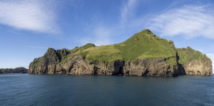 Steep cliffs in the blue sea, Westman Islands, Iceland, Europe