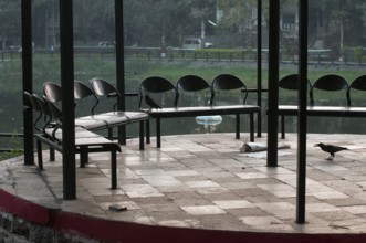 Chairs sitting arranged in garden Pune Maharashtra India Asia Feb 2012