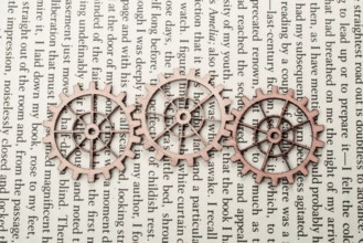 Wooden cogwheels on a page of a book. Industry concept information