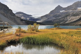 Shining azure surface of the lake. Early autumn in the Rocky Mountains of Canada