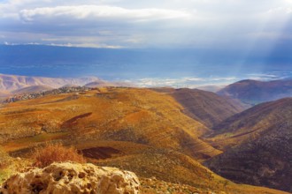 Legendary Dead Sea. Ancient terracotta-colored mountains surround the healing waters of the Dead