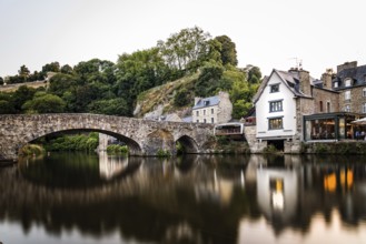 View of the medieval vridge over river Rance and the harbour of the city of Dinan, French Brittany.