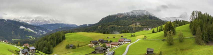 Scenic alpine landscape with village and pastures in South Tirol, Italy, Europe