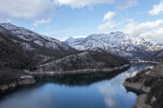 Mounains Lagoon Ancoa in the snow en region Maule, Chile. Aerial drone view