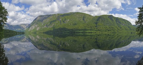 Mountain range reflected in Lake Bohinj, Triglav National Park, Julian Alps, Gorenjska region or