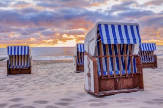 Wonderful sunrise at the beach in summer with beach chair
