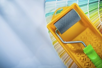 Color sampler paint roller tray on white surface