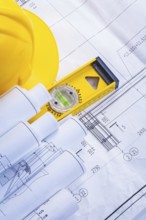 Construction level helmet rolled blueprints