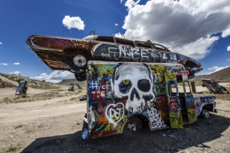 Scrap cars decorated with graffiti in the Carforest of Goldfield, Nevada, USA, North America