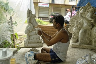 Man making Ganesh idol, alibag, Maharashtra, India, Asia