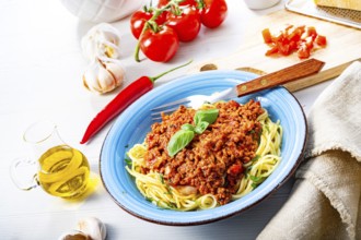 Delicious spaghetti bolognese on a white background