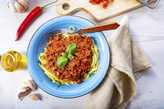 Delicious spaghetti bolognese on a white background