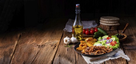 Rustic gyros plate it green salad and potato wedges