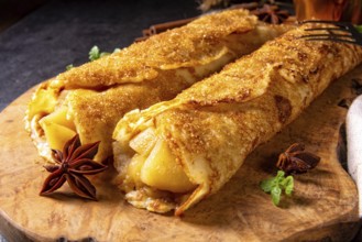 Tasty autumnal omas pancakes with apple and cinnamon