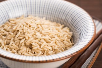 Raw brown rice in a bowl