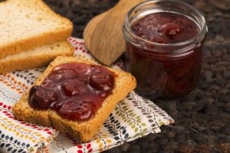 Breakfast of cherry jam on toast