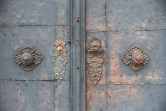 Door handle, ornate wrought ironwork, church door of the Church of the Merciful Brothers, Graz,