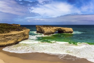 Fantastically picturesque Pacific coast of Australia. White surf foam and azure waves. The concept